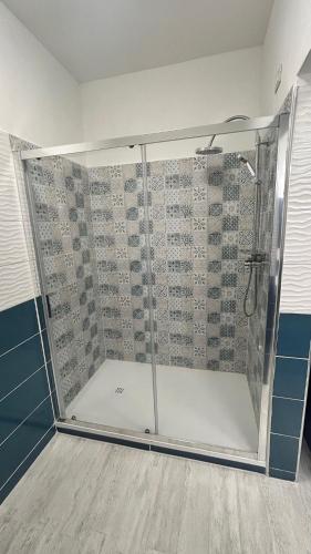 a shower with a glass door in a bathroom at Hotel Centro Congressi Polo Nautico in Salerno