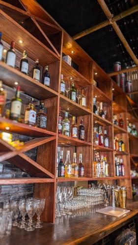 a bar with many bottles of alcohol and glasses at Skybar Koh Rong in Koh Rong