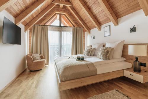 a bedroom with a large bed and a window at Apres Ski Bachleda - LoftAffair Collection in Zakopane