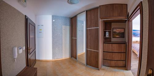 a hallway with a door to a bedroom at Vila Olívia - Apartmán Olívia 2 in Ružomberok