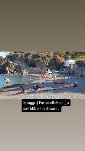 a picture of a beach with people in the water at Itaca 2 in Lipari