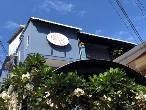 a building with a sign on the side of it at Bat Chum Villa in Phnom Penh