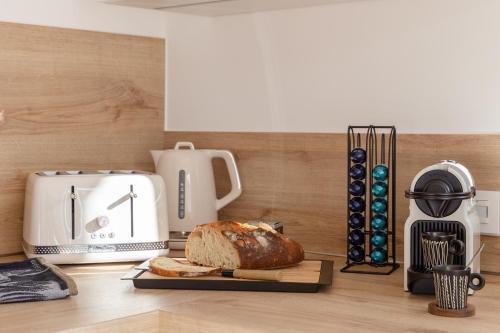 Příslušenství pro přípravu čaje a kávy v ubytování Appartements du comte de Dabo