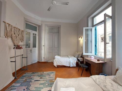 a room with a bed and a desk in it at Alexandria private rooms, Only For Men 仅限男士 in Alexandria