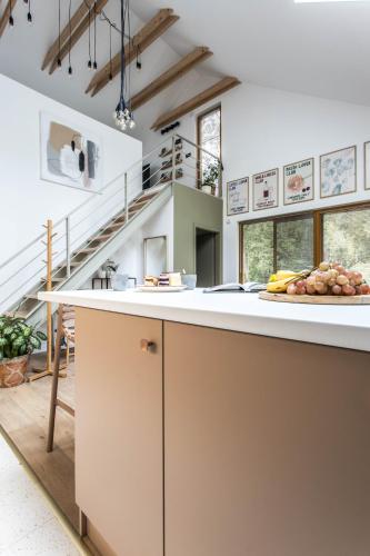a kitchen with a counter with a plate of food on it at Az én kabinom Orfű in Orfű