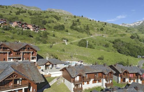 a group of houses in a mountain village at Résidence Odalys Le Grand Panorama 1 in Valmeinier