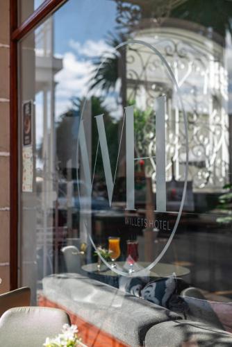 a sign in a window of a restaurant at The Willets Boutique Hotel in Simon's Town in Simonʼs Town