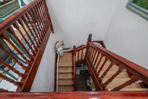a staircase with wooden railings in a house at The Willets Boutique Hotel in Simon's Town in Simonʼs Town
