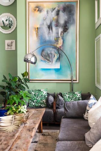 a living room with a couch and a table at The Willets Boutique Hotel in Simon's Town in Simonʼs Town