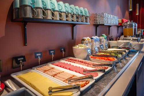 a buffet line with many different types of food at Hotel Fridhem in Stockholm