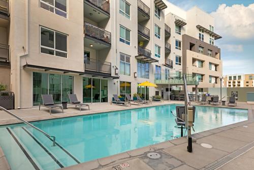an image of a swimming pool at a apartment complex at Modern Comfort in LA Free Parking&10 Min To Cedars in Los Angeles