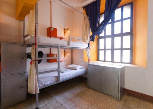 Ένα ή περισσότερα κρεβάτια σε δωμάτιο στο Hostel De Boca en Boca