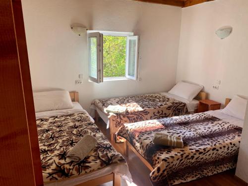 Postel nebo postele na pokoji v ubytování Sofia Guest House