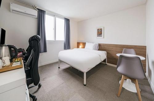 Katil atau katil-katil dalam bilik di Gaon J Stay Hotel