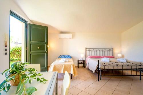 a hotel room with two beds and a window at Nazario Sauro - Lucca by the walls in Lucca