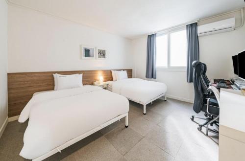 Katil atau katil-katil dalam bilik di Gaon J Stay Hotel