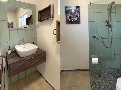 a bathroom with a sink and a shower at Anka's Cozy Holiday Home in Swakopmund