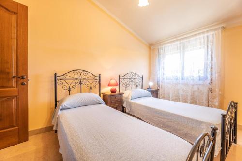 Ένα ή περισσότερα κρεβάτια σε δωμάτιο στο Villa dell'edera