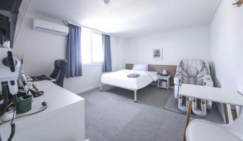 Katil atau katil-katil dalam bilik di Gaon J Stay Hotel