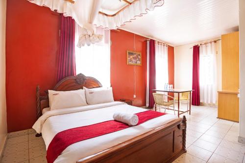 Postel nebo postele na pokoji v ubytování Melvic Hotel