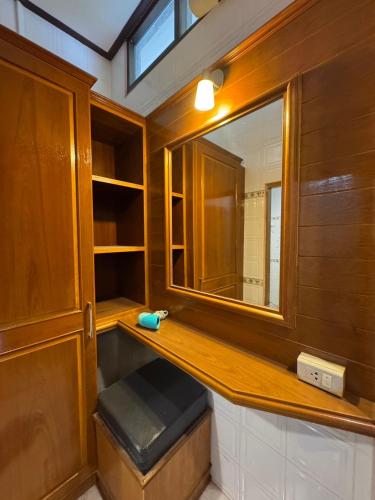 a bathroom with a wooden counter and a mirror at Kantiang Bay View Resort in Ko Lanta