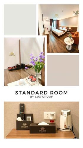 a room with a living room and a standard room at LuxTel Hotel Tây Hồ in Hanoi
