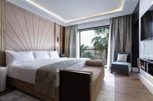 a hotel room with a bed and a balcony at Concorde El Salam Cairo Hotel & Casino in Cairo