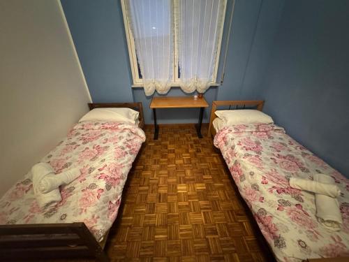 Postel nebo postele na pokoji v ubytování Cozy home baranzate