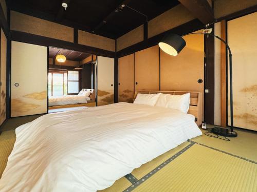 Ένα ή περισσότερα κρεβάτια σε δωμάτιο στο Whole house rental inn Sekigahara