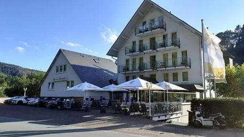 a large white building with umbrellas in front of it at Smart Resorts B&B1 BB1 118 in Winterberg