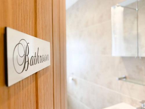 a sign on the door of a bathroom at Lakeway in Penrith