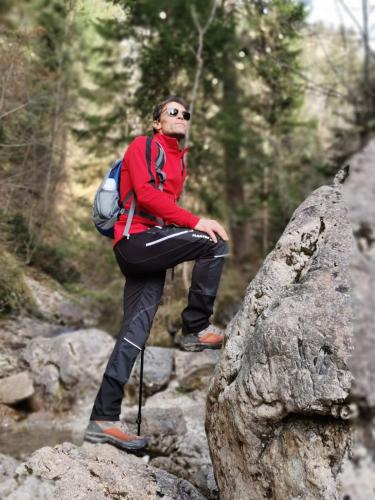 a person sitting on top of a rock at Hotel Natur-Landhaus Krone in Maierhöfen