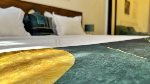 a close up of a bed in a hotel room at Res'Zac in Rufisque