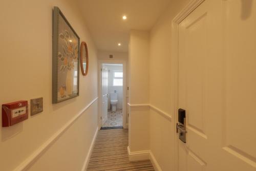 a hallway of a home with a hallway at Florence Gardens Boutique Hotel and Restaurant in Portsmouth