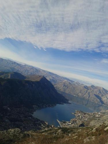 a view of a lake in the middle of a mountain at Apartmani Vila Marija in Budva