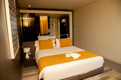 Postel nebo postele na pokoji v ubytování Noom Hotel Niamey