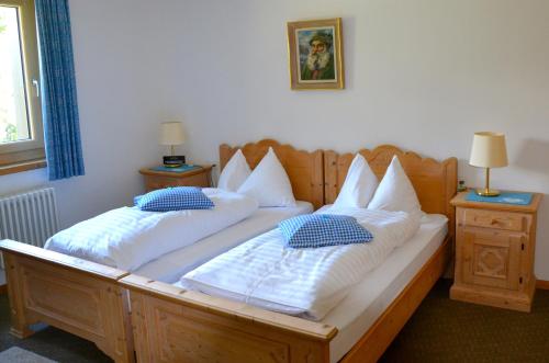Ein Bett oder Betten in einem Zimmer der Unterkunft Hotel Roseg-Gletscher