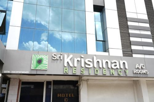 a sign on the front of a building at Sri Krishnan Residency in Pollāchi