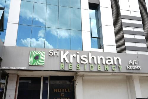 a sign on the front of a building at Sri Krishnan Residency in Pollāchi