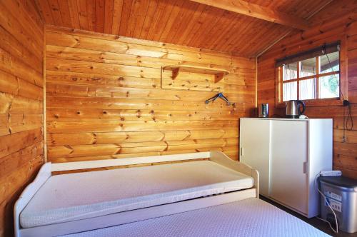 Katil atau katil-katil dalam bilik di Ferienholzhaus Sternchen mit Terrasse
