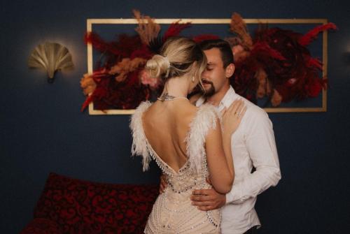 a bride and groom standing next to each other at Maiers Kuschelhotel Loipersdorf - ADULTS ONLY in Loipersdorf bei Fürstenfeld