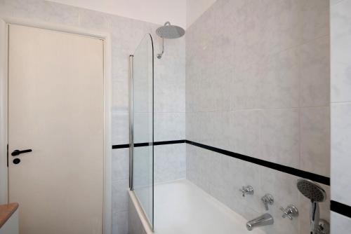 a bathroom with a shower and a bath tub at Appartamento Gabbiano in Rapallo