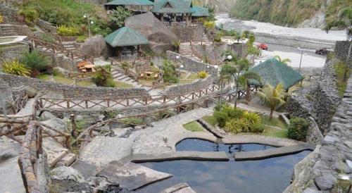 a model of a resort with a bridge over a river at Devera Hotel in Angeles