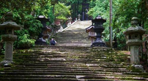 a set of stairs with a person walking up them at Diamond Hotel Tokyo in Tokyo