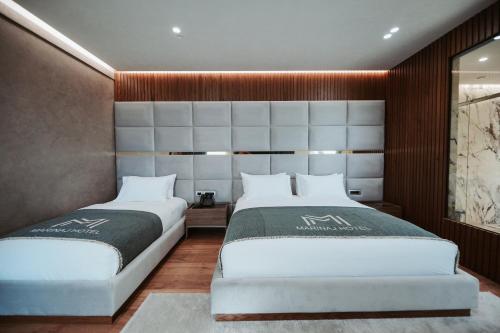Postel nebo postele na pokoji v ubytování Marinaj Hotel & SPA