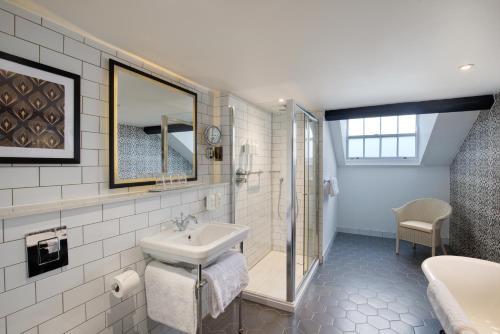 a bathroom with a sink and a shower at Elmbank York, Tapestry Collection by Hilton in York