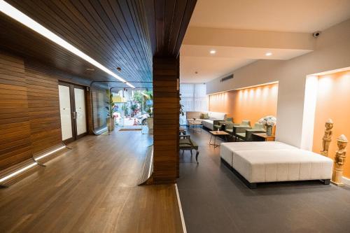 a bedroom with a bed and a living room at Hotel Beyond in Izmir