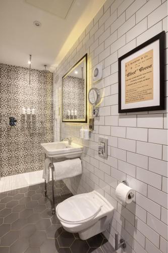 a bathroom with a toilet and a sink at Elmbank York, Tapestry Collection by Hilton in York
