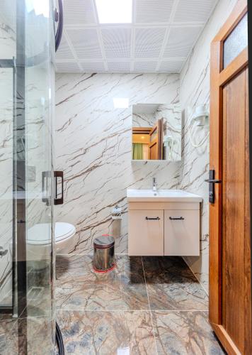 a bathroom with a sink and a shower at Hotel Silviya in Istanbul