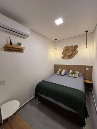 Ένα ή περισσότερα κρεβάτια σε δωμάτιο στο Flat aconchegante em Juquehy! Com piscina!